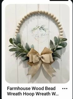 the farmhouse wood bead wreath is hanging on a door