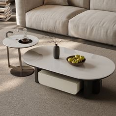 a living room with a couch, coffee table and two vases on the floor