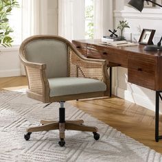 an office chair sitting in front of a desk with a lamp on top of it