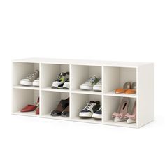 a white shelf with several pairs of shoes on top and one pair in the bottom