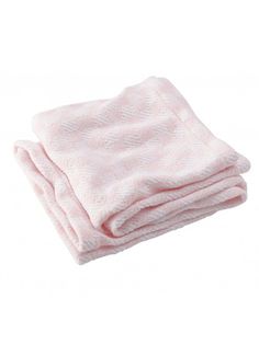 the pink blanket is folded on top of each other, and it looks like they have been