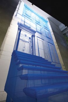 an abstract photograph of blue stairs in front of a building