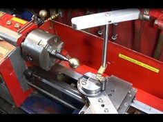 a machine that is working on some metal parts