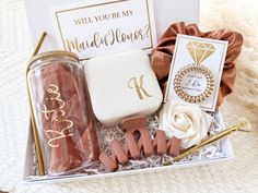 a gift box filled with pink and gold items