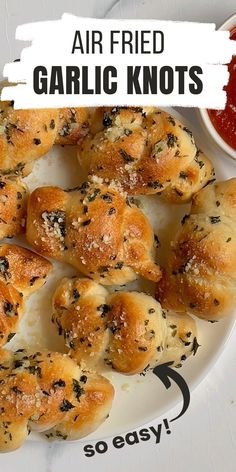 garlic knots on a plate with ketchup and sauce