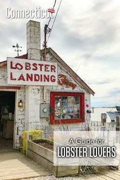 an old lobster store with the words lobster landing on it's front and side