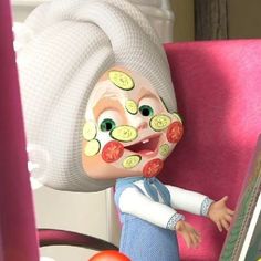 an animated doll with cucumbers on her face and hair, sitting in a chair