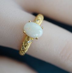 Embrace timeless elegance with our Vintage-Look Classic Style White Opal Ring. This stunning piece exudes sophistication, featuring a captivating white opal set in a vintage-inspired design. The ring effortlessly blends classic charm with contemporary style, making it the perfect accessory for any occasion. These opal stones are untreated and unprocessed, ensuring their genuine nature. All orders include tracking for your assurance. If you have any uncertainties regarding your order, please feel White Opal Ring, Crystal Opal, Gift Package, Vintage Inspired Design, Opal Ring, Australian Opal, Opal Crystal, White Opal, Opal Rings