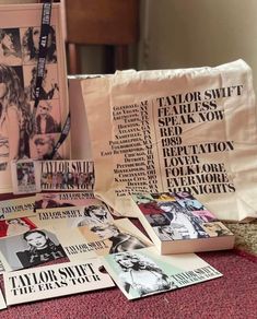 the covers of taylor swift's new album are on display in front of a pillow