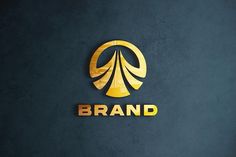 the brand logo is gold and black on a dark blue background with an arrow in the center