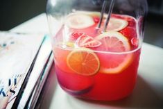 a pitcher filled with liquid sitting on top of a table