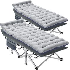 three folding beds with mattresses on them