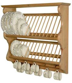 a wooden rack with plates and cups on it