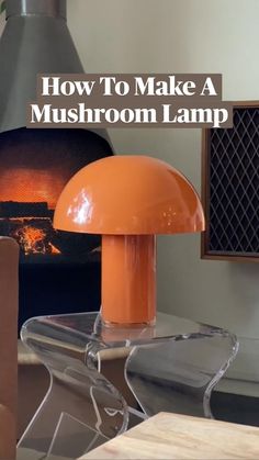 an orange mushroom lamp sitting on top of a table