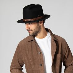 Features: Brim Size: 2.75" 100% wool Size: Men's s/m: 58cm, l/xl: 60cm Wool felt cowboy hat with embossed faux leather trim and studs Western Style Fur Felt Fedora With Flat Bill, Casual Leather Fedora With Short Brim, Western Hats With Leather Lining And Adjustable Fit, Western Hat With Adjustable Leather Lining, Adjustable Western Hat With Leather Lining, Leather Winter Hat With Flat Bill, Adjustable Leather Hat For Fall, Leather Brimmed Fedora For Rodeo, Leather Fedora Hats For Rodeo