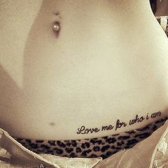 a woman's stomach with the words love me by who i am written on it