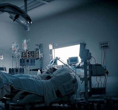 an empty hospital room with lots of medical equipment