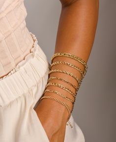 These stunning gold bracelet sets are waiting for you! Stack them... chic & classic! The chains are dainty and glistening, making it the perfect bracelet for a special occasion as well as everyday wear. DETAILS: *All bracelets are adjustable to fit multiple wrist widths. You can create your own layered look by choosing your favorite designs in the drop down menu! QUALITY: We beautifully package every item in a jewelry gift box. * All orders are hand crafted with care from our happy studio in sun Luxury Gold Chain Bracelet Chic Style, Gold Bracelet Photography, Luxury Gold Chic Chain Bracelet, Trendy Gold Stackable Chain Bracelet, Trendy Stackable Gold Charm Bracelet, Bracelet Pictures Ideas, Gold Trendy Stackable Chain Bracelet, Chic Tarnish-resistant Gold Bracelet, Trendy Gold Stackable Charm Bracelet