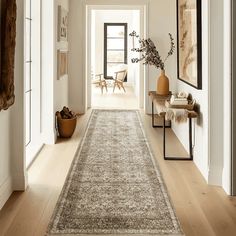 the hallway is clean and ready for us to use as an entrance way in this home