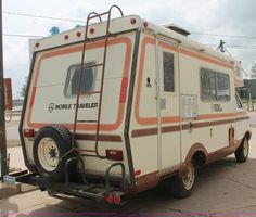 an rv is parked on the side of the road