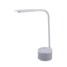 a white desk lamp sitting on top of a table