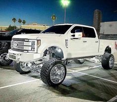 a large white truck parked in a parking lot