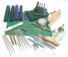 the tools are laid out on the cutting board to be used for making handmade items