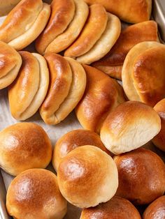 bread rolls in a baking pan ready to be baked