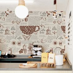 a coffee shop counter with wallpaper on it