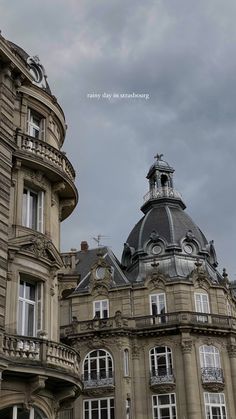 an old building with many windows and a clock tower