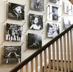 a staircase with many pictures hanging on the wall