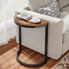 a living room with a white couch and wooden table on the floor next to it