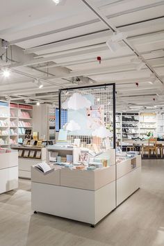 the interior of a retail store with shelves and books on display in front of them