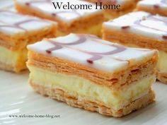 several pieces of cake sitting on top of a white plate with the words welcome home