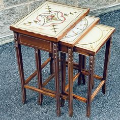 two wooden stools sitting on top of each other