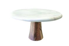 a white marble table with wooden base on a white background for use as an accent piece