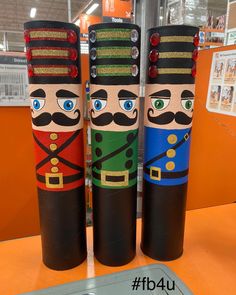 three wooden nutcrackers on display in a store