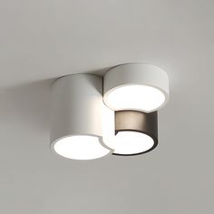 two circular lights are mounted on the wall