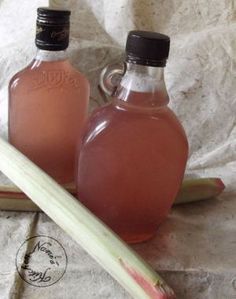 two bottles of liquid sitting on top of a piece of paper