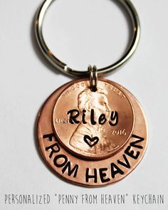 a penny keychain with the words riley from heaven engraved on it's side