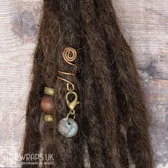 Antique Bronze coloured hand-wrapped wire adjustable dreadlock jewellery, with rustic removable Tibetan Bronze cast heart charm. Hairwraps UK's dread cuffs are a beautiful way of attaching charms into your dreadlocks, natural plaited (braided) hair or synthetic/wool dreads. If your hair isn't dreadlocked, to use the cuff simply plait (braid) your hair to the appropriate thickness, secure the end with a braiding band (supplied with the cuff), then slide the cuff on to your plait. Dread cuffs can Plait Braid, Simple Purse, Dreadlock Jewelry, Bronze Hair, Wool Dreads, Hair Charms, Hair Cuffs, Dread Beads, Clip On Charms