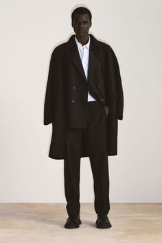 DOUBLE-FACED WOOL COAT - Black - COS Cos Coat Wool, Black Wool Coat With Concealed Placket And Lapel Collar, Black Wool Coat With Lapel Collar, Black Double-breasted Wool Coat With Concealed Placket, Black Wool Coat With Concealed Placket For Winter, Classic Black Oversized Wool Coat, Black Wool Coat With Concealed Placket, Oversized Notch Lapel Wool Coat For Formal Occasions, Oversized Wool Coat With Notch Lapel For Formal Occasions