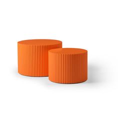 two orange stools sitting next to each other