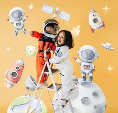 two young children in space suits standing on a ladder near an astronaut's mural