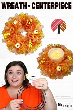 a woman is holding a candle in front of two wreaths that have been made with yarn