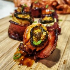 some food that is on top of a cutting board with other foods in the background