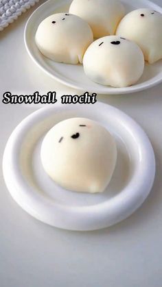 two white plates filled with snowball mochillos on top of a table