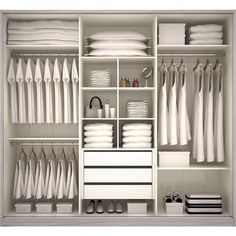 an organized closet with white clothes and accessories