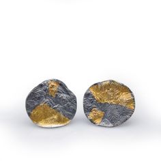 Gold & Silver Earrings - Lightweight and comfortable, the Roccia earrings have sculptural, geologically craggy surfaces and catch the light beautifully.These post earrings are hand fabricated in reticulated sterling silver. The surfaces of the earrings have been fused with a fine 23.5-karat gold sheet, utilizing the Korean keum boo technique. The earrings are oxidized and burnished to bring out the gold and silver hues and the organic forms.The measurement of the large variation of the earri Modern Hand Cast Sterling Silver Earrings, Modern Hand Cast Earrings As A Gift, Contemporary Earrings With Oxidized Finish, Contemporary Oxidized Finish Earrings For Gift, Contemporary Earrings With Oxidized Finish As Gift, Contemporary Oxidized Finish Earrings, Keum Boo Jewelry, Gold Sheets, Keum Boo