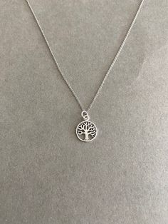 "Tiny Mini Tree of Life Silver Necklace - Sterling Silver Color : Silver Material : Sterling Silver Tree of Life Size : 12mm Chain Length : 16\" / 18\" / 20\" * Metal components are Sterling Silver. * Suitable for delicate and sensitive skin. * Comes in a jewelry box. If you need extra boxes for gifting....just let us know! Less" Silver Round Charm Necklace 16 Inch, Silver Necklaces 16 Inch For Everyday, 2024 Manifesting, Bluey Characters, Poison Tree, Necklaces With Meaning, Mini Tree, Tree Of Life Jewelry, Star Necklace Silver